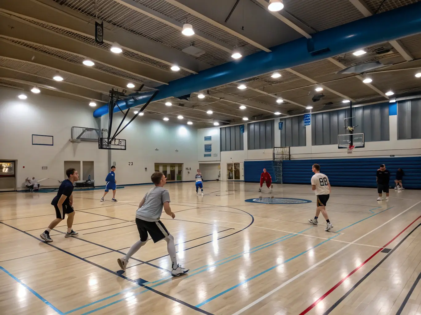 A group of students participating in a basketball training session at COLLEGE VOLTAIRE, focusing on teamwork and skill development.